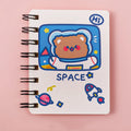 Astronaut themed pocket notebook showing 10.5 x 8 cm dimensions with space decoration