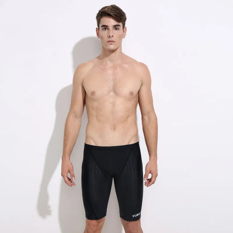 Men's black polyester swimming set with trunks, anti-fog goggles, cap, ear plugs, nose clip, and carrying bag