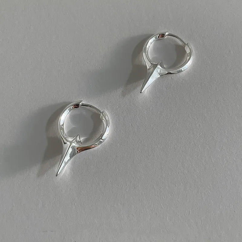 Geometric star-shaped women's ear clips in a platinum colour with a clip-on fastening.