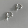 Geometric star-shaped women's ear clips in a platinum colour with a clip-on fastening.