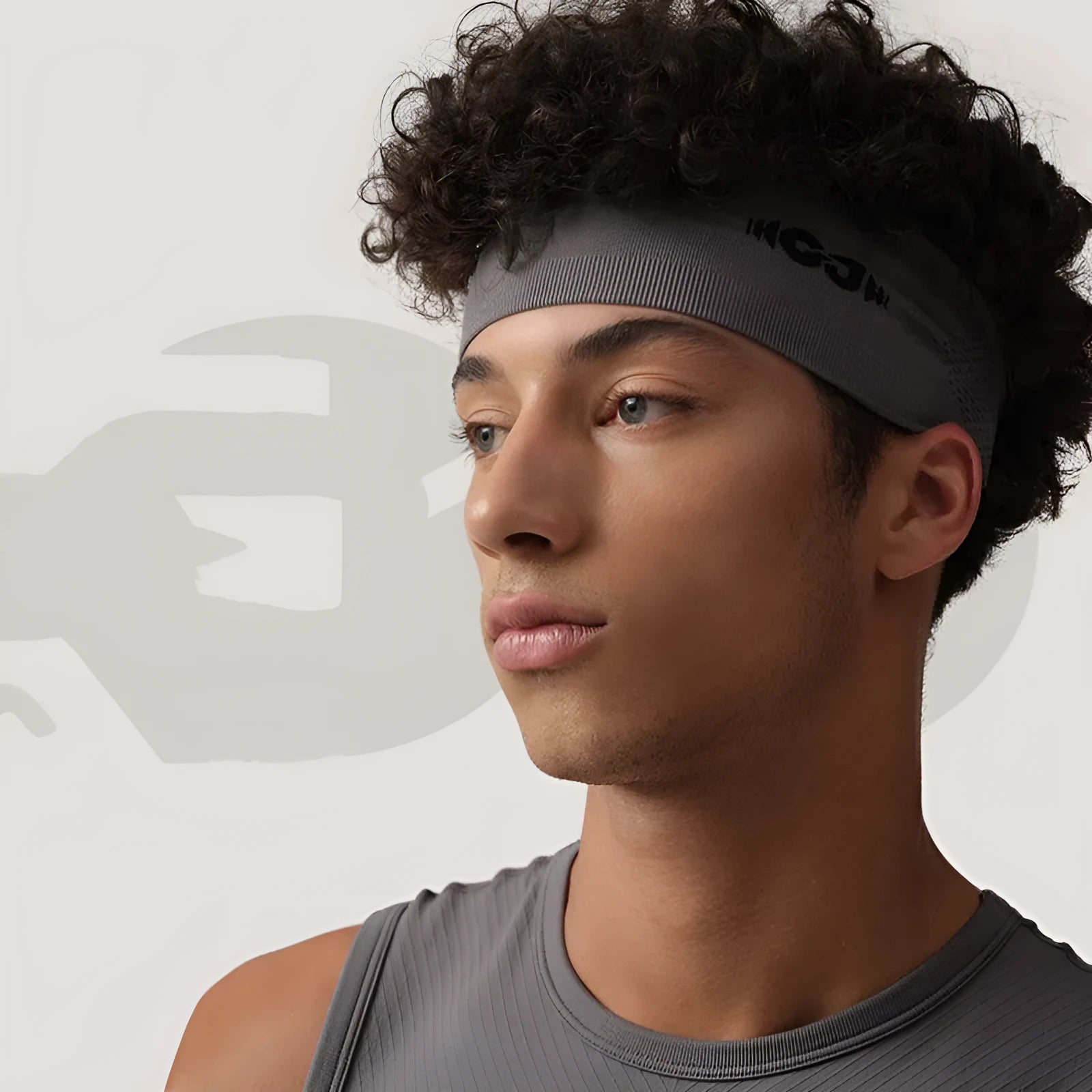 Seamless knitted exercise hair band in Classic Black, shown stretched, for running and cycling.