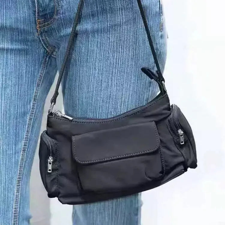 Black lightweight women's shoulder bag with double pockets and side line detail