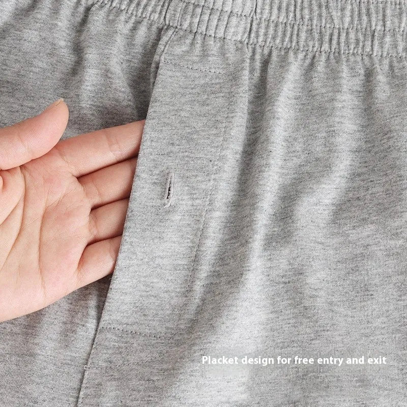 Men's high-waist loose fit cotton boxer shorts in black, shown flat.