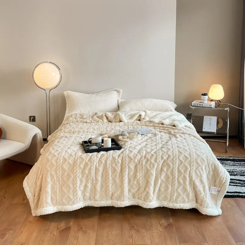 Polyester thermal flannel blanket in beige colour, folded to show texture, for winter bed use.