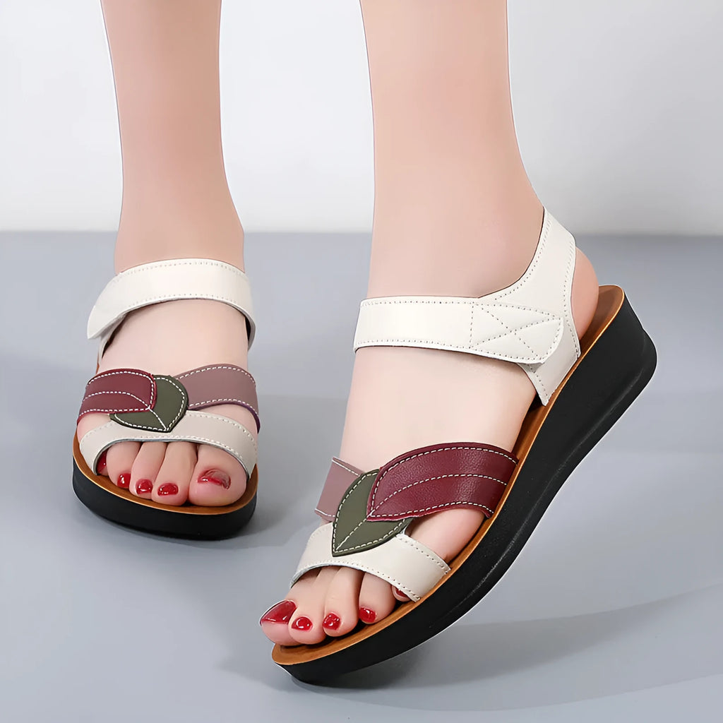 Women's thick-soled Velcro sandals in beige with side hollow design and colour blocking on a flat surface