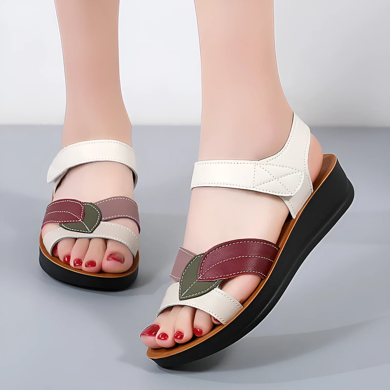 Women's thick-soled Velcro sandals in beige with side hollow design and colour blocking on a flat surface