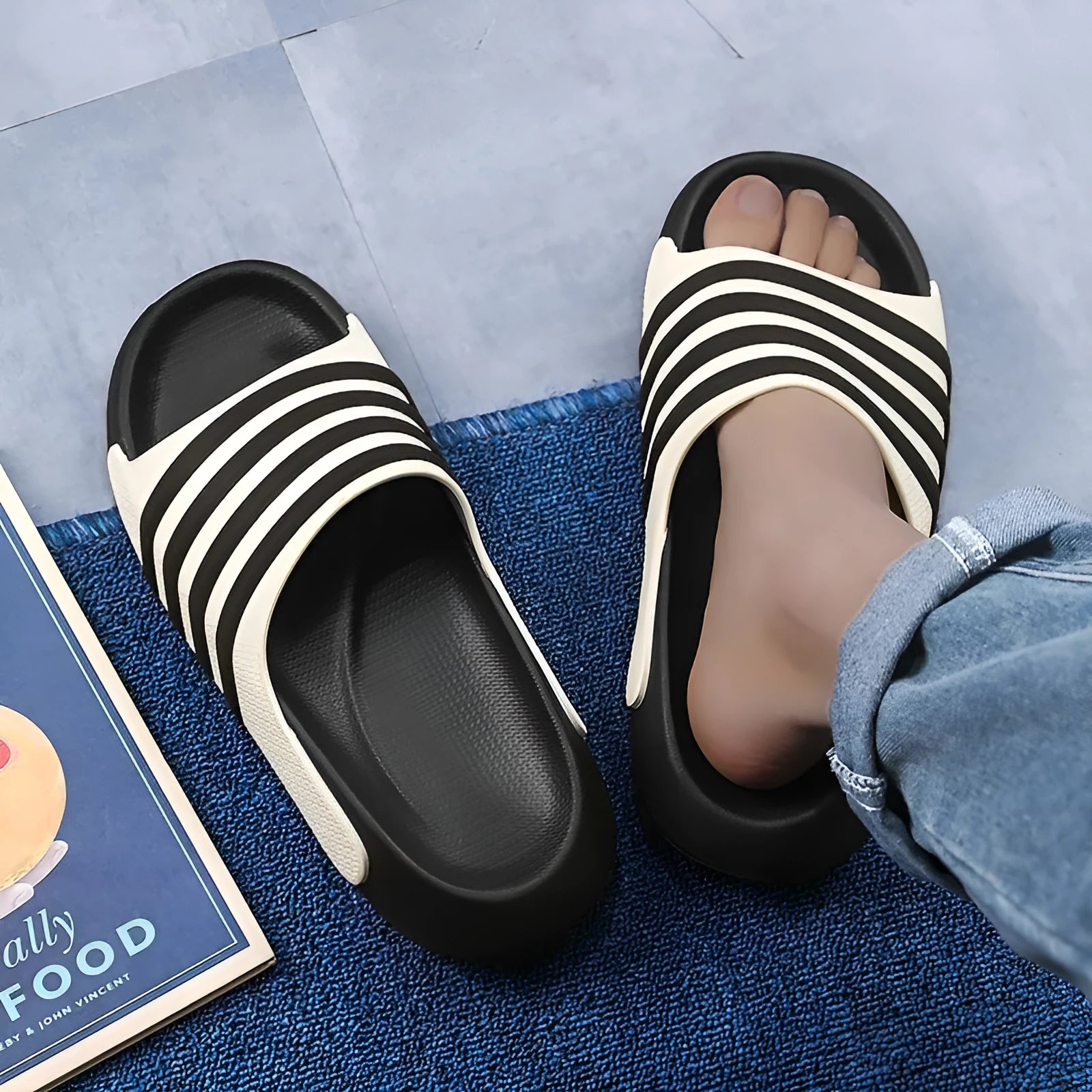 A pair of casual unisex slippers with a PVC upper and EVA sole, shown in a selected colour.