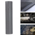 Roll of black perforated automotive vinyl wrap film showing mesh texture and scale.