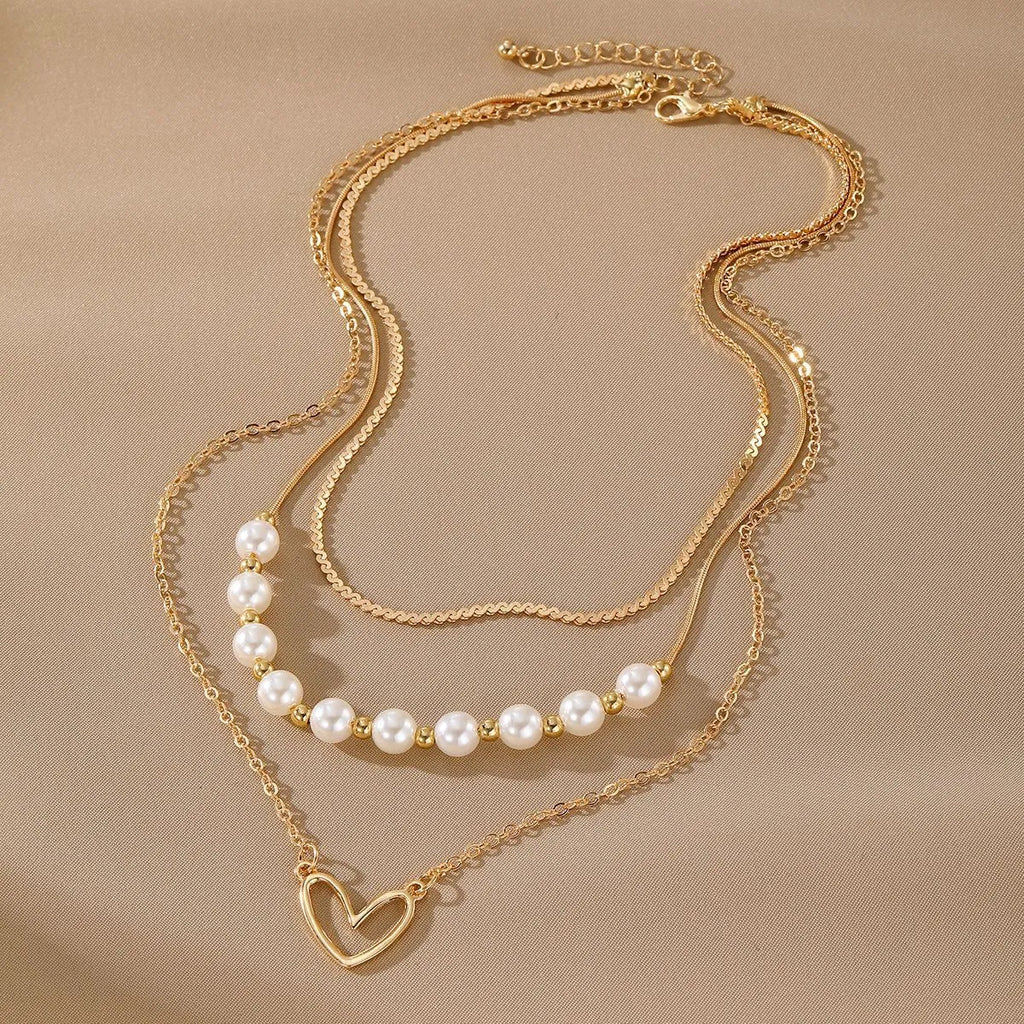 Vintage gold heart pendant necklace with pearl chain design in three colour options