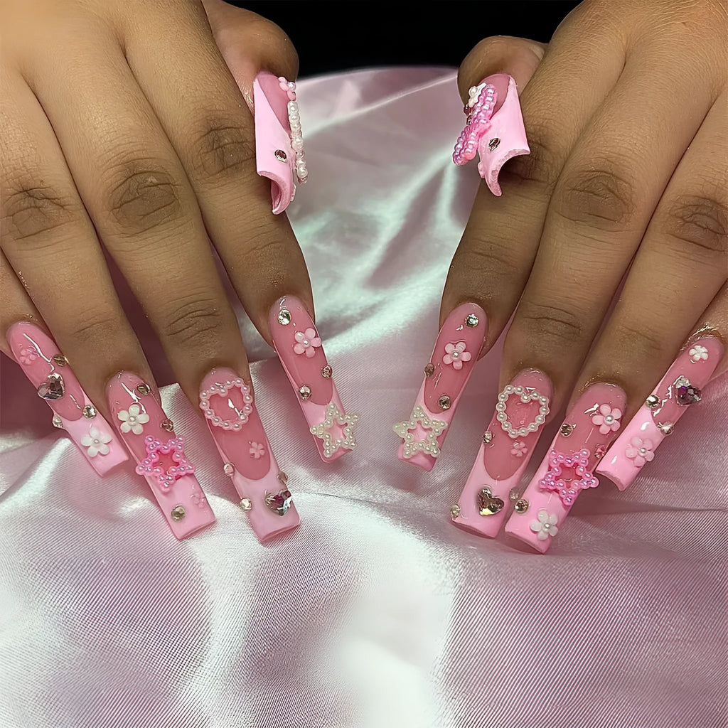 French style stick-on false nails with a love pattern and bow detail in colour XB-70-48 on a plastic armour suit.