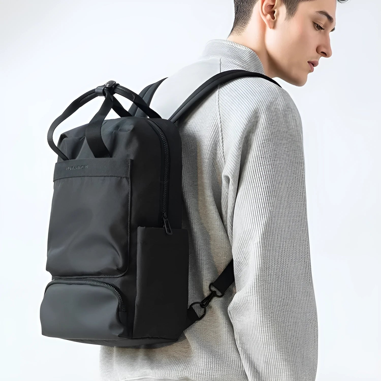 Elegant black Oxford cloth computer backpack with 20-35 litre capacity and polyester lining
