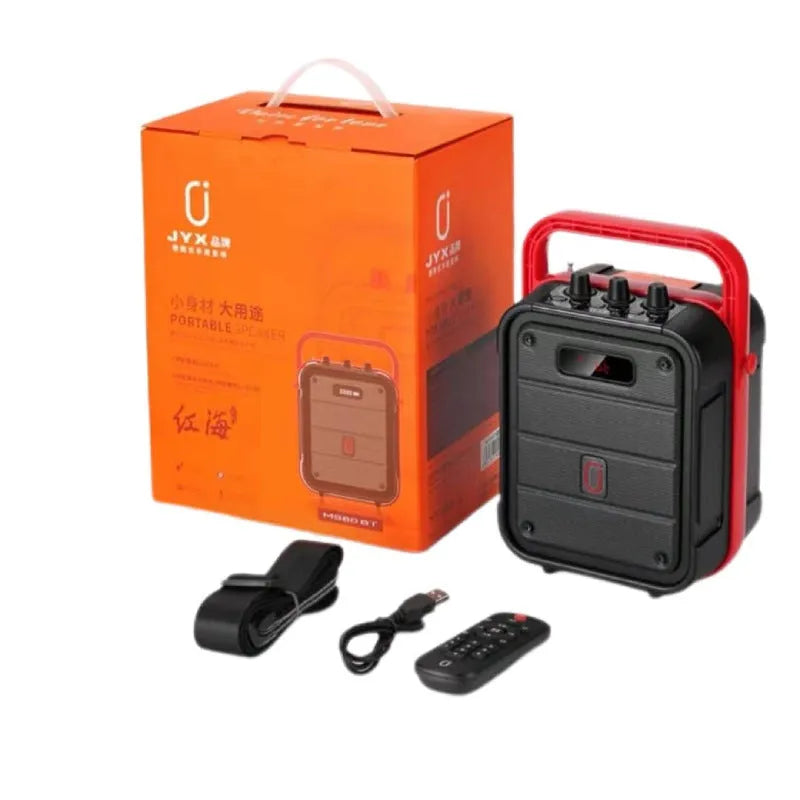 MS62AI portable Bluetooth speaker with wireless microphone, remote control, and charging cable.