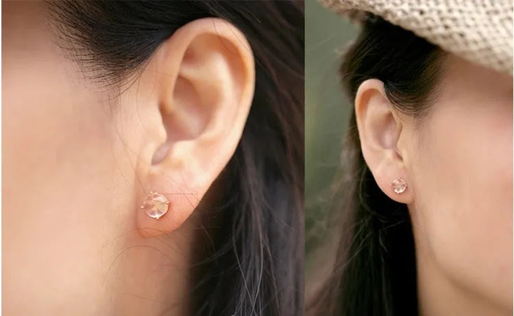 Women's rose gold drop shape stud earrings with crystal inlay detail