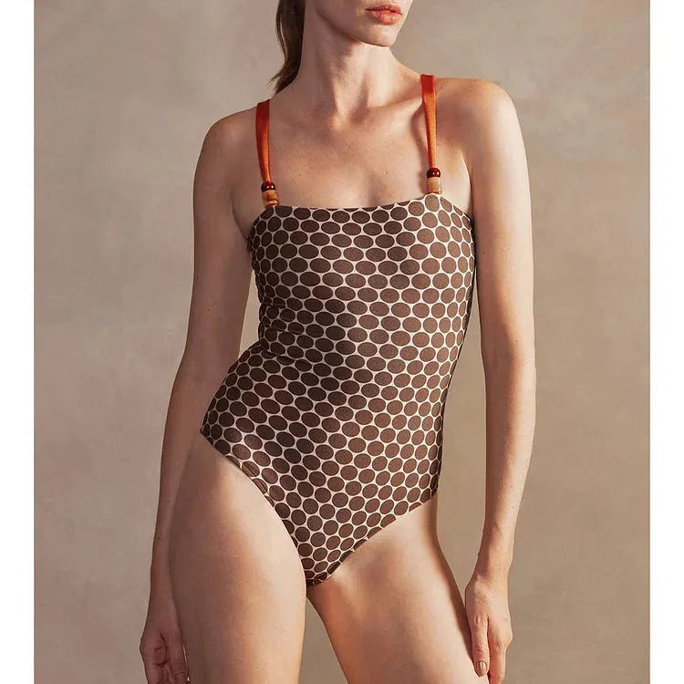 Women's printed one-piece swimsuit with dots pattern and matching wrap skirt