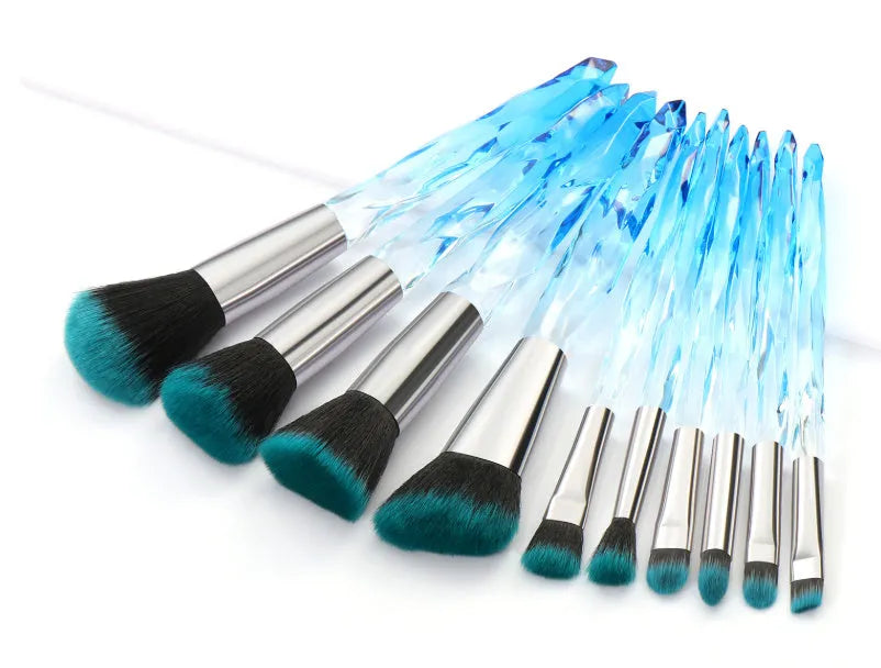 Set of 10 clear crystal handle foundation brushes with diamond shank design and synthetic bristles.