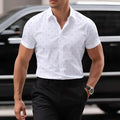 Men's light blue floral print short-sleeved shirt with buttons, made from stretchy polyester fabric.