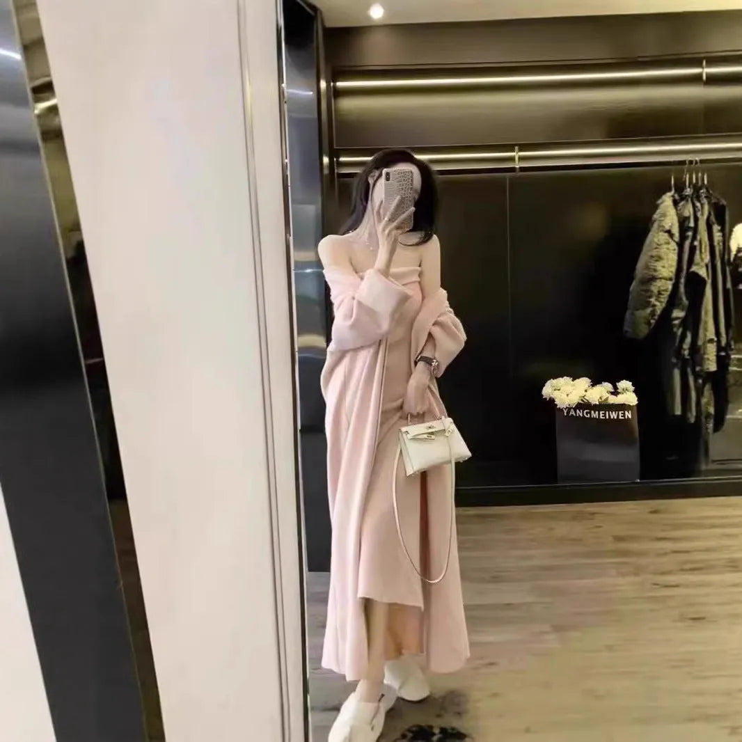Women's grey knitted dress and matching coat suit with flocked pattern, long skirt, and regular sleeves.
