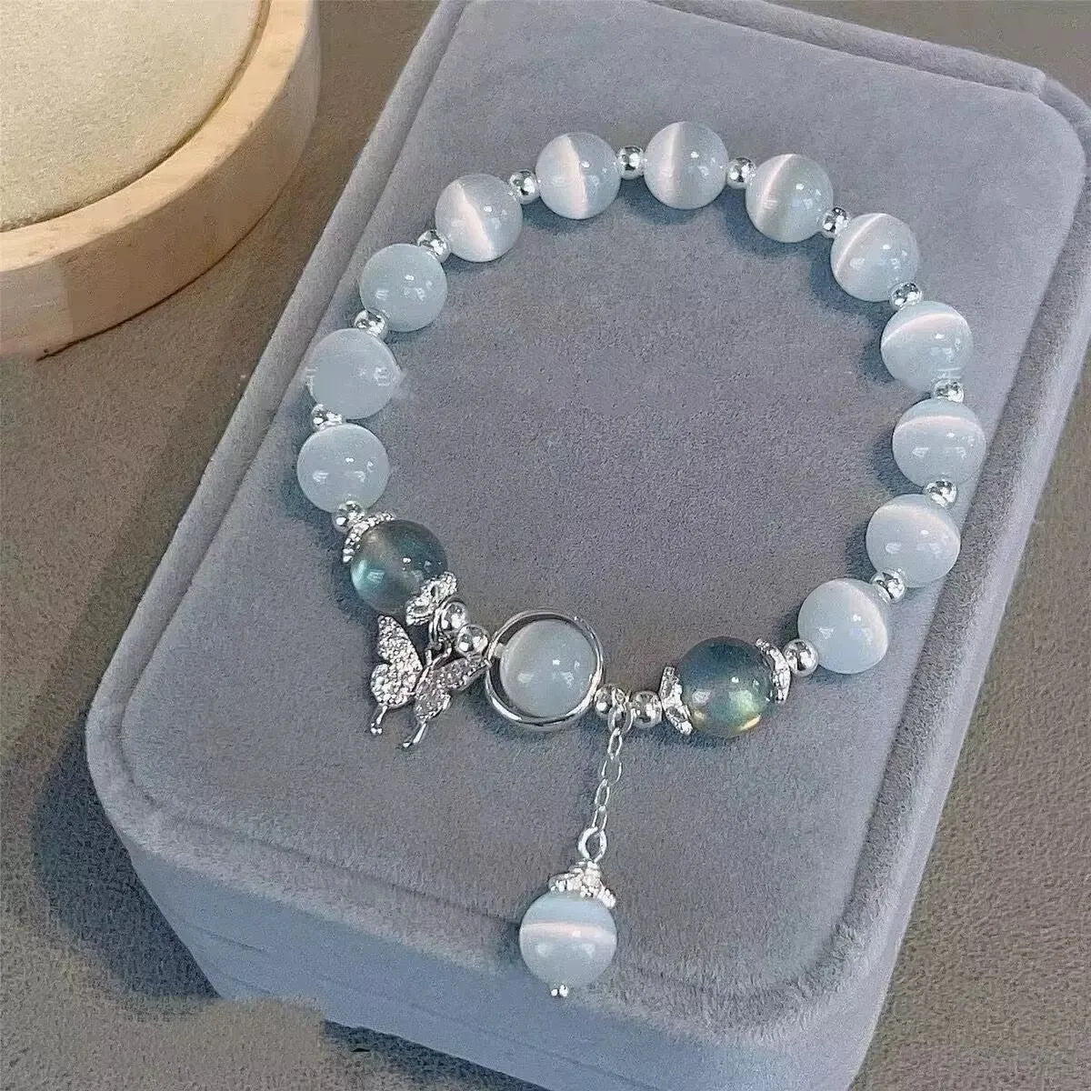 Handmade glass butterfly bracelet for women with adjustable silver clasp and grey moonstone beads