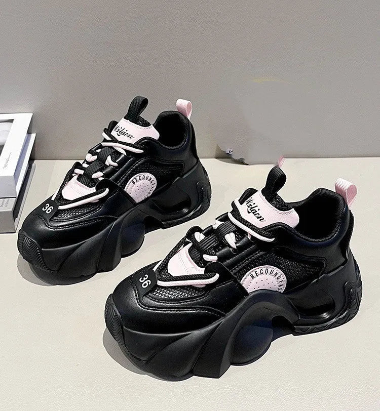 Women's pink casual sneakers with thick sole and cross-shoulder straps on a white background