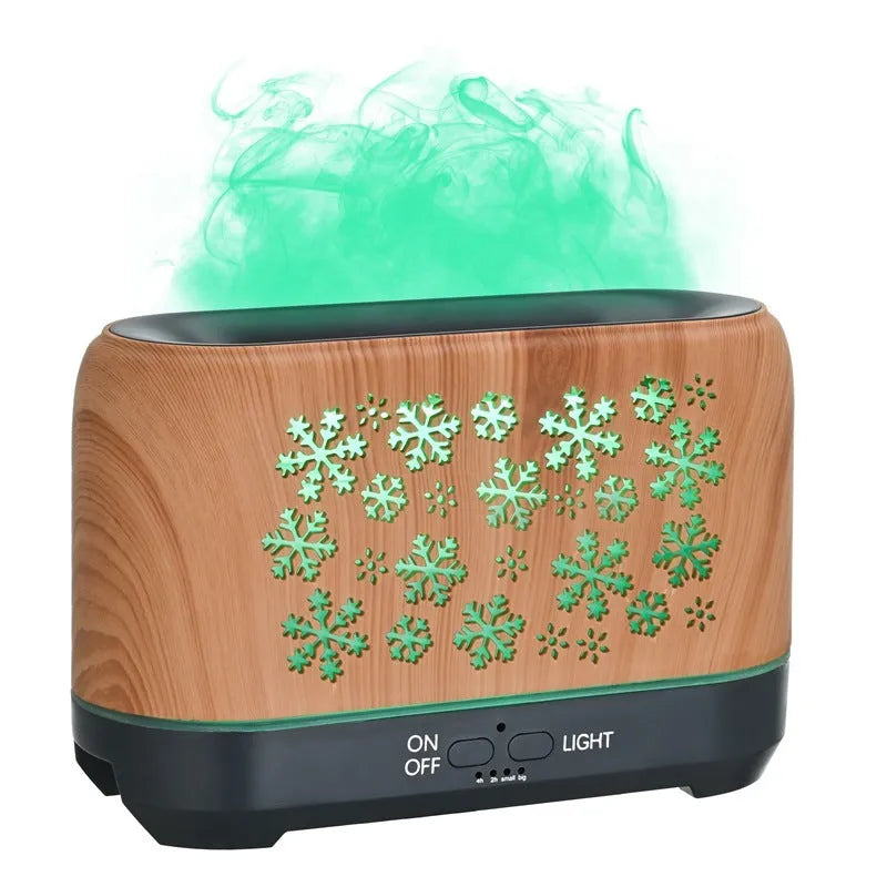 Christmas snowflake pattern ultrasonic aromatherapy humidifier with colourful flame light effect on a desk.
