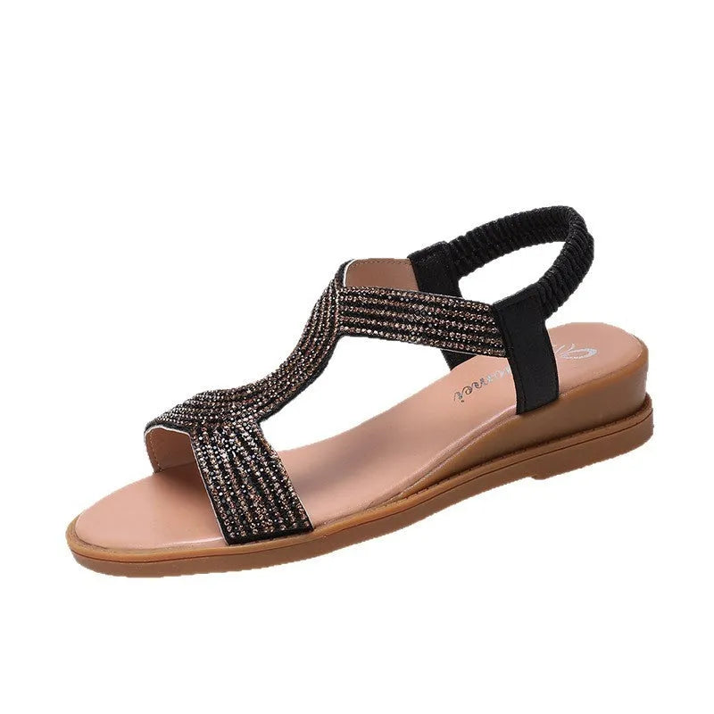 Gold women's patent leather beach sandals with round toe, rhinestones, and a non-slip sole.