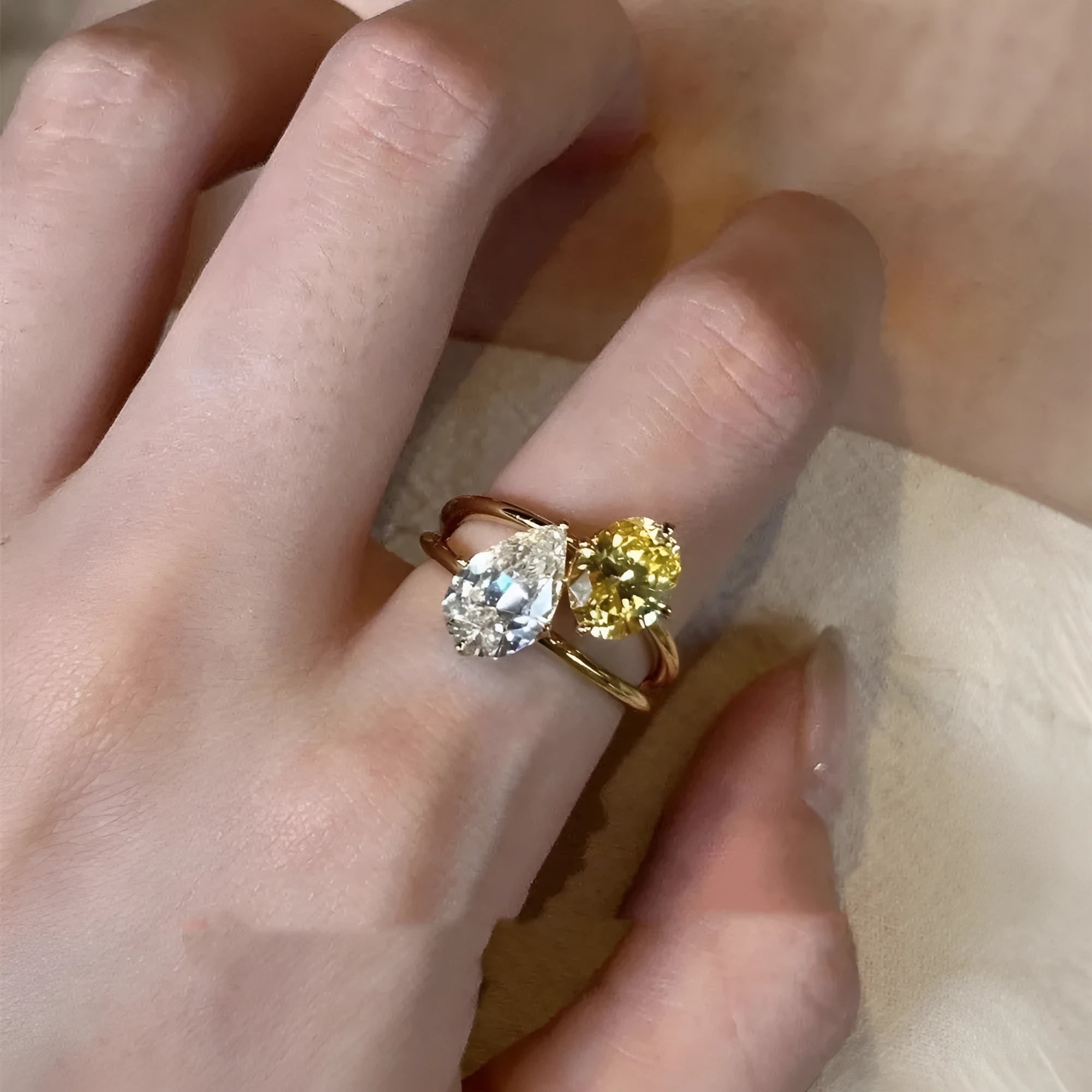 Water drop geometric open ring with copper construction and double Sheng stone detailing