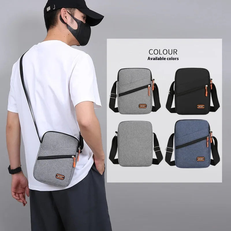 Oxford cloth crossbody commuter bag with contrast detailing in silver grey, black, or navy blue