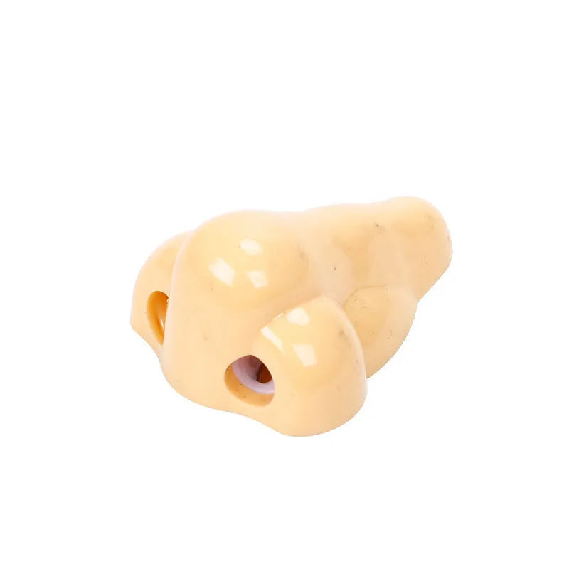 Flesh colour plastic pencil sharpener with geometry shape measuring 58×45×30mm for student stationery