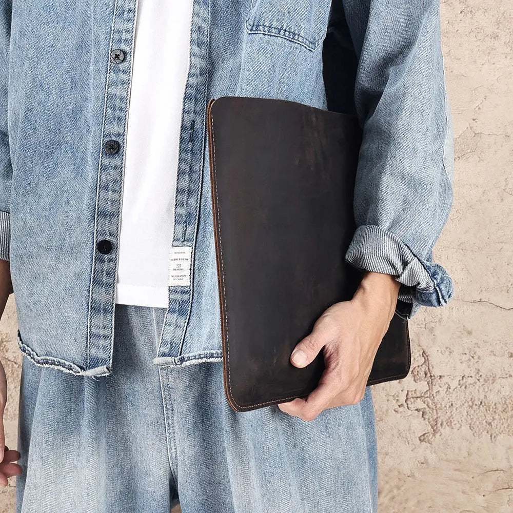 Brown crazy horse leather horizontal computer liner bag showing organisational compartments