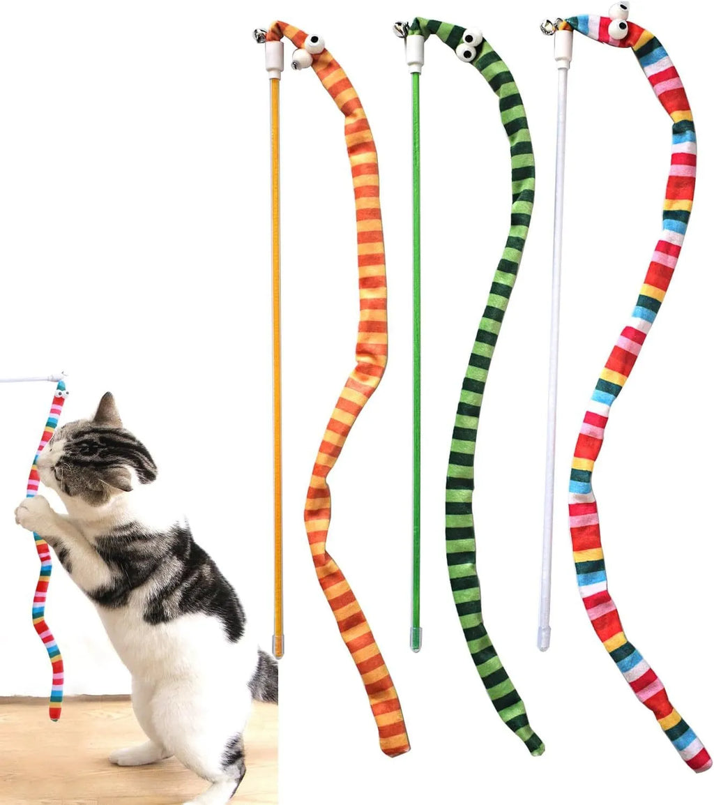 A colourful cat teaser wand with a long plush strip and a bell, held by a person.