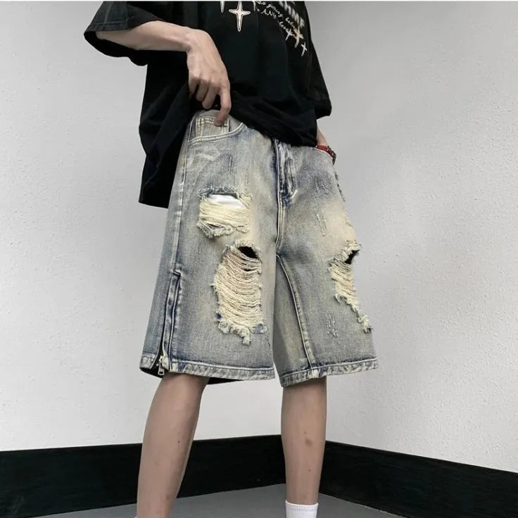 Blue retro-style women's denim shorts with a wide-leg loose fit and tattered detailing.