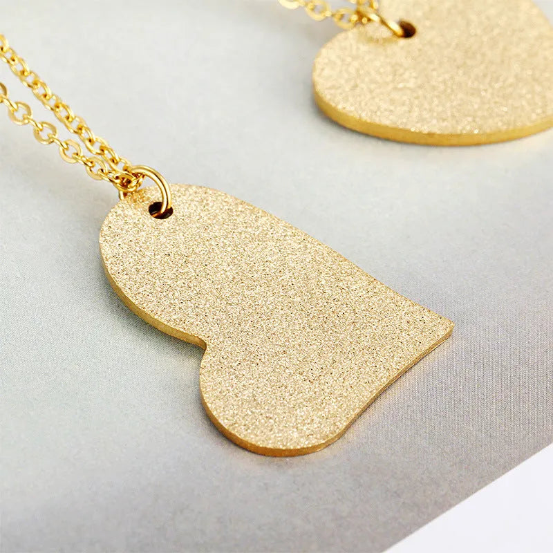 Geometric heart-shaped titanium steel necklace pendant in colour KN25736-Z.