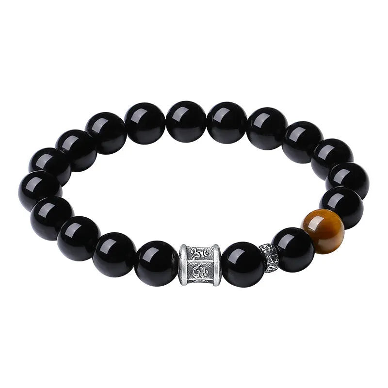 Men's obsidian bracelet with pure silver elements and six-word mantra prayer wheel design