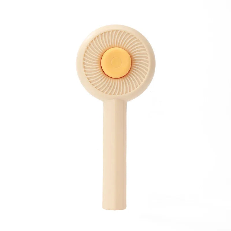 Blue self-cleaning pet grooming brush with angled stainless steel bristles and massage tips