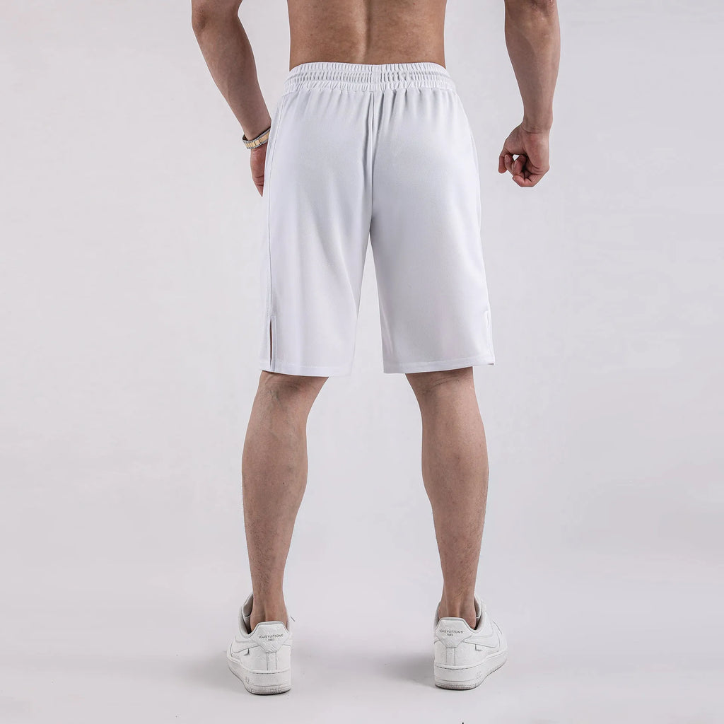 Man wearing black loose-fit quick-dry mesh fitness shorts with an elastic waistband.