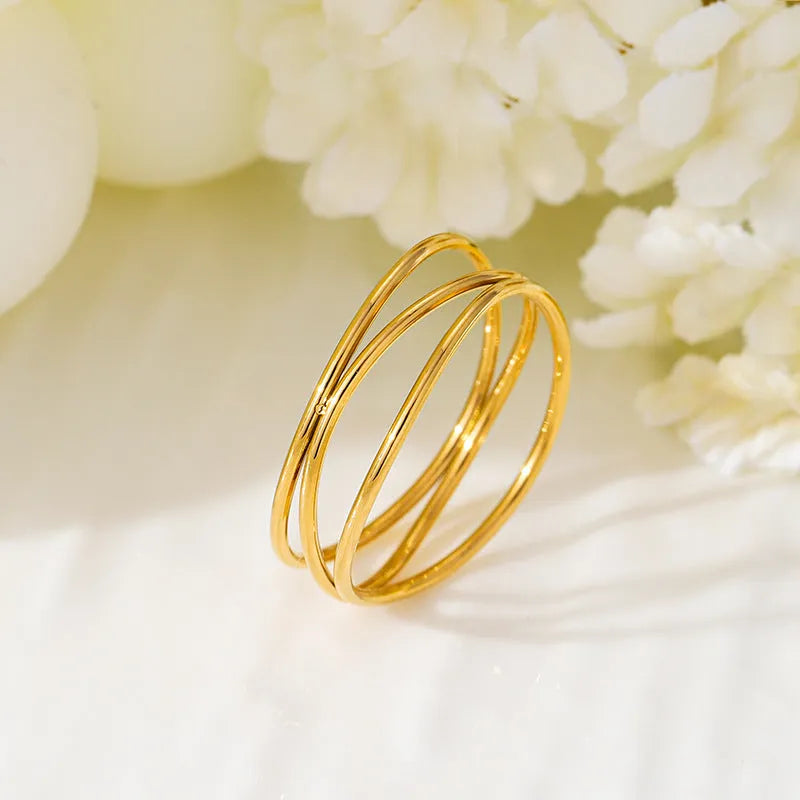 Gold electroplated titanium steel ring with three-layer geometric coiled line design