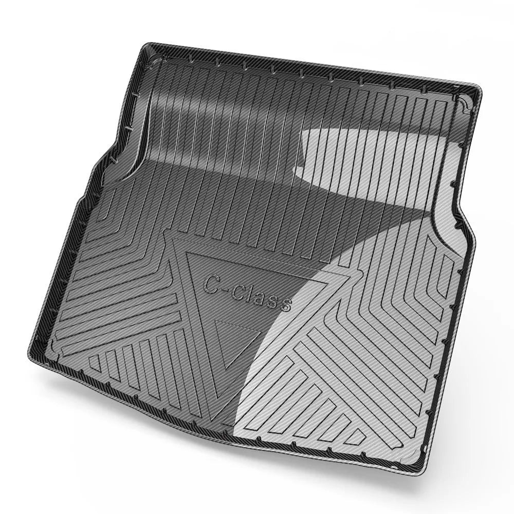 Black car boot liner with carbon fibre pattern, designed for a model-specific TPE tail pad fit.