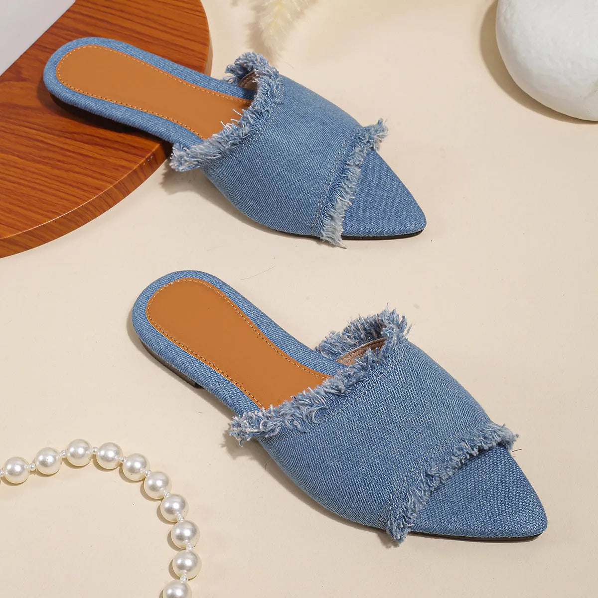 Women's denim flat slippers with tassel detail and leather lining in apricot colour