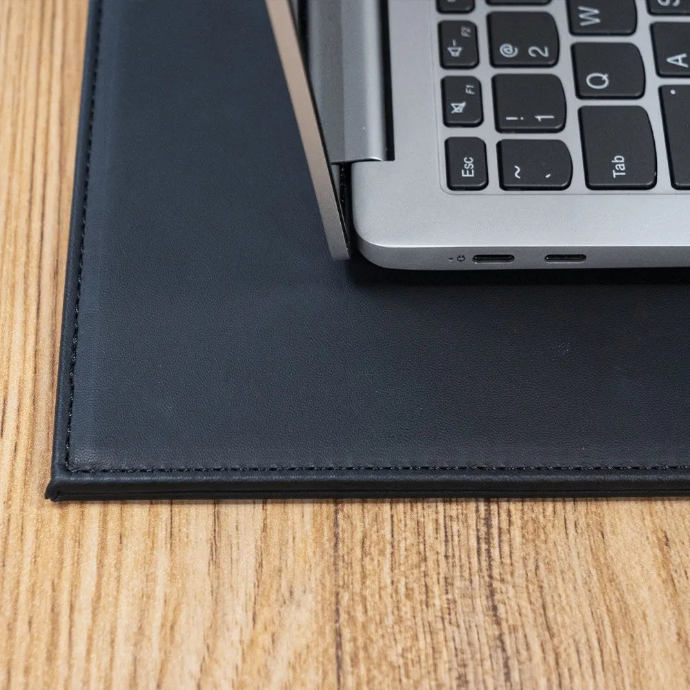 Heat-insulating anti-radiation printing tablet pad for laptops and digital tablets in blue colour on a wooden desk.