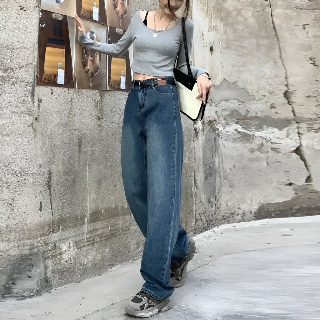 Women's high-waist retro blue straight-leg jeans on a model, showing the classic fit.