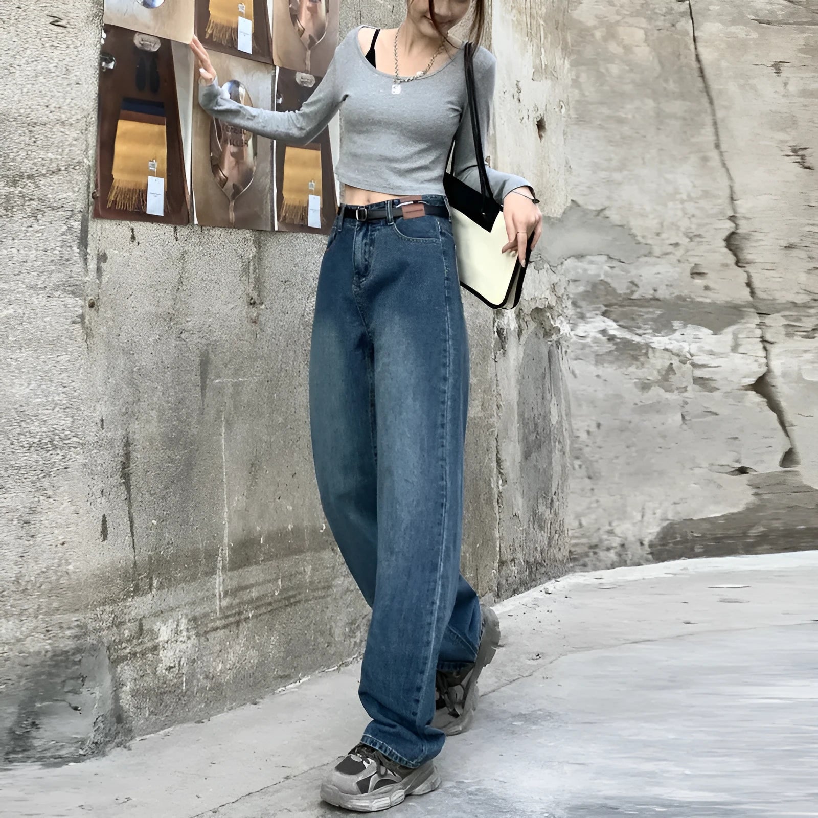 Women's high-waist retro blue straight-leg jeans on a model, showing the classic fit.