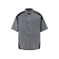 Retro washed blue denim short-sleeve jacket and trouser suit set laid flat.