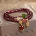 Purplish red garnet crystal fox charm bracelet with adjustable rope design
