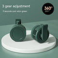 Green wrist-mounted fan with blades, LED light, and USB charging port on a silicone strap.