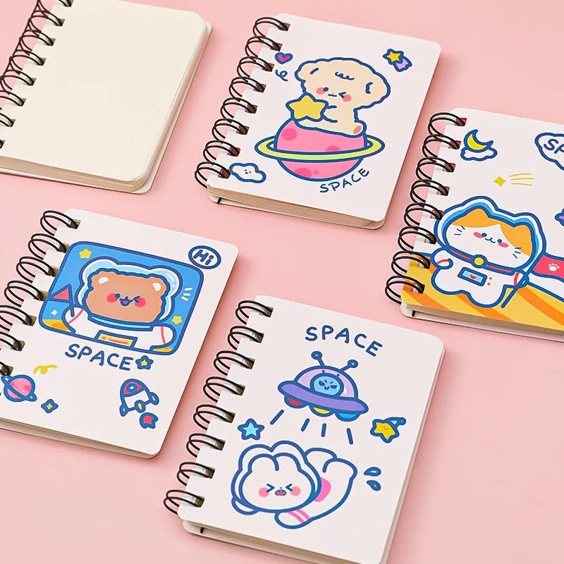 Astronaut themed pocket notebook showing 10.5 x 8 cm dimensions with space decoration