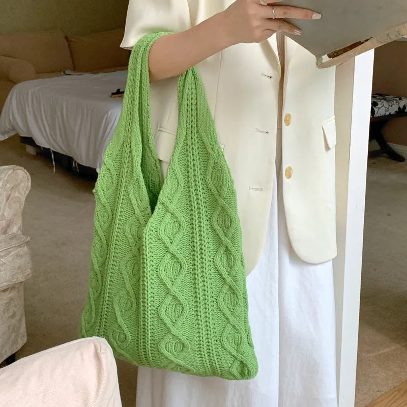 Retro hollow-knitted shoulder tote bag in solid colour with double straps showing textured yarn construction