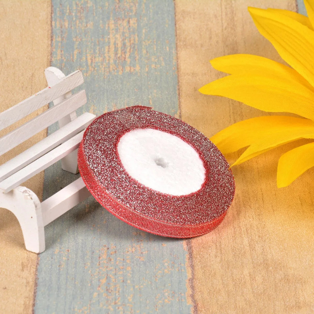 Green onion coloured polyester ribbon with gold polka dots on 25-yard spool for decorative trimming