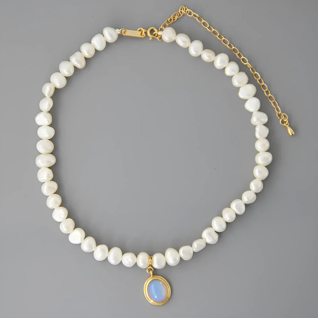 Geometric pearl silver necklace with irregular pearls and adjustable length on white background