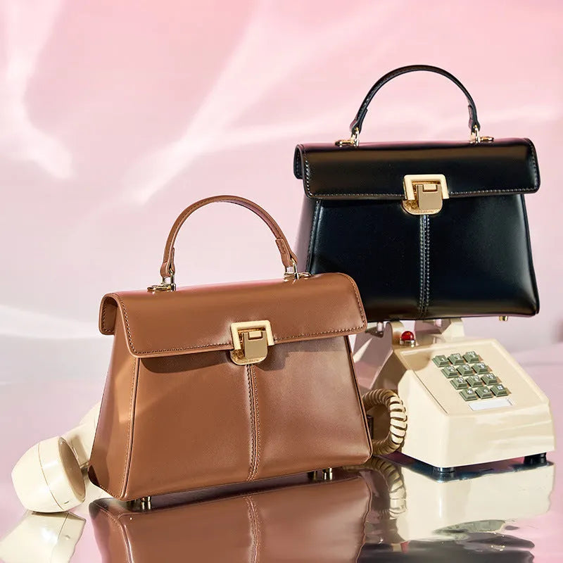Genuine leather women's shoulder bag in horizontal square shape with adjustable strap.