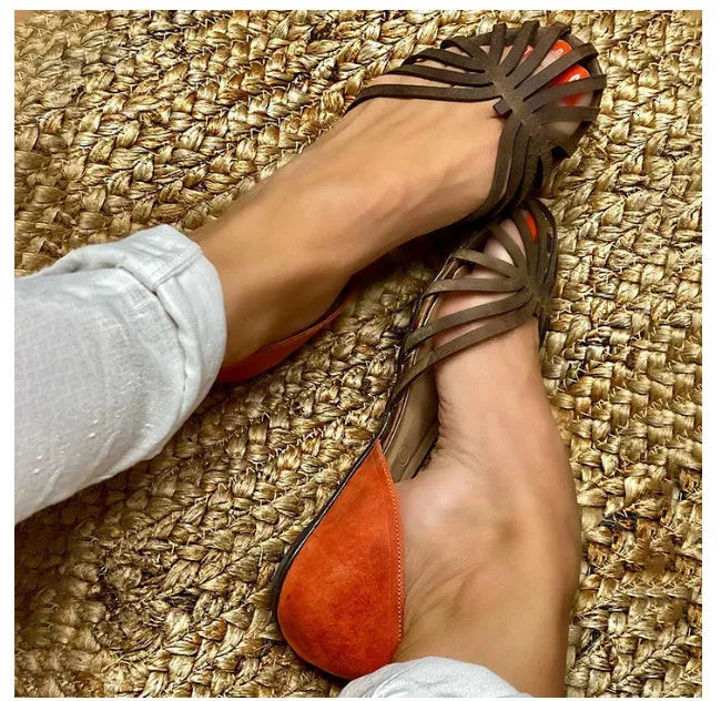 Women's flat leopard print sandals with a square buckle ankle strap on a rubber sole.